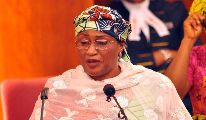 Love letter to Aisha Buhari Tunde Odesola (Published in The PUNCH on Monday, March 22, 2021) Dear Hajiya, With gratitude to God for a vacation well spent, I, Babatunde Odesola, Esq., heartily rejoice on the safe return of the First Lady, Hajiya Aisha Buhari, to Nigeria after spending 4,380 hours in the cozy United Arab Emirates city called Dubai, away from the kisses and cuddles of her aged husband, Major General Muhammadu Buhari (retd.), and the scrutiny of his ineffective security forces. Hajiya, I love you. Many people don’t know what we share. They don’t know we were both born on February 17. I’ve sorely missed your dazzling beauty in the last six months that you left the warmth of your husband’s bedroom to enjoy the breathtaking wonder of the 9.7-million-population UAE, a country 11 years younger and 12 times smaller than the giANT of Africa, breathless in the fist of your old sweetheart, Pa Buhari. Going by the stunning beauties of their wives and rumoured concubines, Nigerian Heads of State between 1960 and 1999 appeared more adept at capturing the hearts of beauty queens than providing solutions to the problems of the country. From General Johnson Aguiyi-Ironsi to General Yakubu Gowon as well as General Murtala Mohammed to General Olusegun Obasanjo and the bloody General Ibrahim Babangida along with the roguish General Sani Abacha, Nigerians can’t forget the vivacious appeal of Victoria Aguiyi-Ironsi, the wowing beauty of Victoria Gowon, the angelic grace of Ajoke Mohammed, the eyeful chicness of Stella Obasanjo, the shapely charm of Mariam Babangida, the exotic elegance of Maryam Abacha, and the brainy goddess, Lami, whom General Abdulsalami Abubakar hypnotized for a wife. Hajiya Aisha, your beauty is smashing! I really don’t know how these generals swing it, but I’ve truly never seen a general with an ugly wife. The alluring belle from the popular Majekodunmi family in Ogun, Omolola, belongs to the Okuku general, Olagunsoye Oyinlola, just as Ronke Ayuba, the adorable TV star, was general Tanko Ayuba’s. These generals! They just know how to cock their love guns at ladies’ hearts, aim and pull the triggers. Tell me, irresistible Aisha, how did the old Katsina general ‘toast’ and capture the love of an extraordinary beauty like you at just 18, despite the 28 years age difference between both of you? Is he the lion and you, the jewel? Hajiya Aisha, I welcome you back to the hell you left since last September, after the life-threatening shooting that occurred in your Aso Rock abode, upon your insistence that an untouchable aide of your husband comply with COVID-19 protocols. Permit me to ask, madam, have your security guards, whose arrest you protested online after their shooting combat with presidential bodyguards, been released? Your husband’s mouthpiece, Shehu Garba, promised that the shooting would be investigated. Like every one of the electoral promises made by your husband, however, the outcome of the Garba-promised investigation will never see the light of the day, I’m sure. Lady Buhari, I believe you’ll agree with me that if you, of all people, could be so trampled on in your husband’s administration, the brutal killing of scores of innocent #Endsars protesters at the Lekki toll gate by soldiers, last October, attests to the fascist in your husband. Remember, Hajiya, you stridently raised the alarm some years ago that your husband had been held captive by some unknown forces. You insisted that he was no longer in charge of his government. Madam Buhari, except maybe his cows, your husband had never been in charge of anything - not even in his famed military days when General Tunde Idiagbon took charge and he, Buhari, took the glory. When your husband went to sleep after fulfilling his chronic ambition of becoming a civilian President, his Chief of Staff, Abba Kyari, saw his abandoned presidential shoes, dusted and stepped into them snuggly, taking full responsibility of governance. After Kyari’s death, the shoes were, again, empty, and bandit politicians, killer-herdsmen, Boko Haram, brigands and sycophants have taken turns to wear them, spinning the country madly out of orbit towards hell as various miscued criminals now unleash anarchy in the land while your ‘mai gida’ remains cool, calm and collected like a motionless crocodile. My dear hajiya, your husband has failed Nigeria woefully! Out of tune with reality, your presidential husband always avoids the Nigerian press but his countless embarrassing mistakes in public have necessitated concerned citizens to patriotically ask for his medical evaluation. My First Lady, Nigeria’s situation has worsened since you escaped to the Arabian sanity. Now that you’re back into the lawless country your husband heads, I must warn you that Nigeria’s decline into depravity is now full-blown. Please, Aisha, don’t get into any argument with any security guard as you did last year. A human head now costs N8,000 in Nigeria. If you’re lucky and timely, you can even get one for free among unclaimed corpses left to decay along Nigeria’s highways. Life is worthless in the land ruled by your husband, Aisha. Scores of innocent people are now being killed, kidnapped and broken daily across the country, much more than the victims of war in Libya, Sudan, Somalia and Congo. I love you Hajiya Aisha but I don’t love your husband because he’s an outstanding blunder. I love you because you occasionally speak up whenever your space is threatened. Some may say that’s selfish of you - that you need to always speak up against the vipers of injustice brooded by your husband’s administration. They say, “What is sauce for the goose is sauce for the gander.” Well, I won’t criticise their opinion. Aisha nee Halilu, do you know that the UAE, like Nigeria, was built with oil money? But the UAE has long left Nigeria behind by diversifying their economy from oil dependency, launching it on science-tech-tourism superhighway. The picture of a rain-beaten church rat placed beside an elephant looms large on the horizon whenever Nigeria is compared to UAE. The wife of my President, the only difference between Nigeria and UAE is leadership, which your husband has tragically failed to give. Nigeria, presided over by your thick-skinned husband, is the strangest country in the world. It’s a place where anyone can disappear without trace. Imagine, a whole you was out of circulation for six months, and there was no explanation from your husband, his friends, relatives and megaphones. Everybody just carried on as if you don’t matter. Aisha, between you and me, I even think they were happy you were nowhere around to squeal on their incompetencies and stagnant governance. During your undisclosed absence, my First Lady, so much water passed under the bridge. African Giant, Burna Boy and Ojuelegba crooner, Wizkid, won Grammy awards. I know your husband sees Nigerian youths as a population of lazybones. I think he’s likely to prefer Dan Maraya Jos music to the music by lazy youths. I was, however, shocked to read a prompt congratulatory message from your husband, extolling the virtues of Burna Boy and Wizkid. Well, I know that the only arm of your husband’s government that’s effective is the ‘Public Service Announcement Department’ that sends out congratulations at the speed of light but sleeps when hundreds of schoolchildren are kidnapped and snores when Fulani herdsmen and Boko Haram kill for fun. When EIGHT persons were killed in suspected anti-Asian shooting in Atlanta, Georgia, last week, President Joe Biden and his deputy, Kamala Harris, flew into Atlanta from Washington DC to commiserate with bereaved families. Over a 100 people have died in various breaches of security across the country this year alone, but our President sits tight in Aso Rock, either unmoved or unaware. Aisha, the masses that prayed for the enthronement of your husband as president are now praying to God to break the country and his government. It’s sad, your husband has failed. Email: tundeodes2003@yahoo.com Facebook: @tunde odesola Twitter: @tunde_odesola