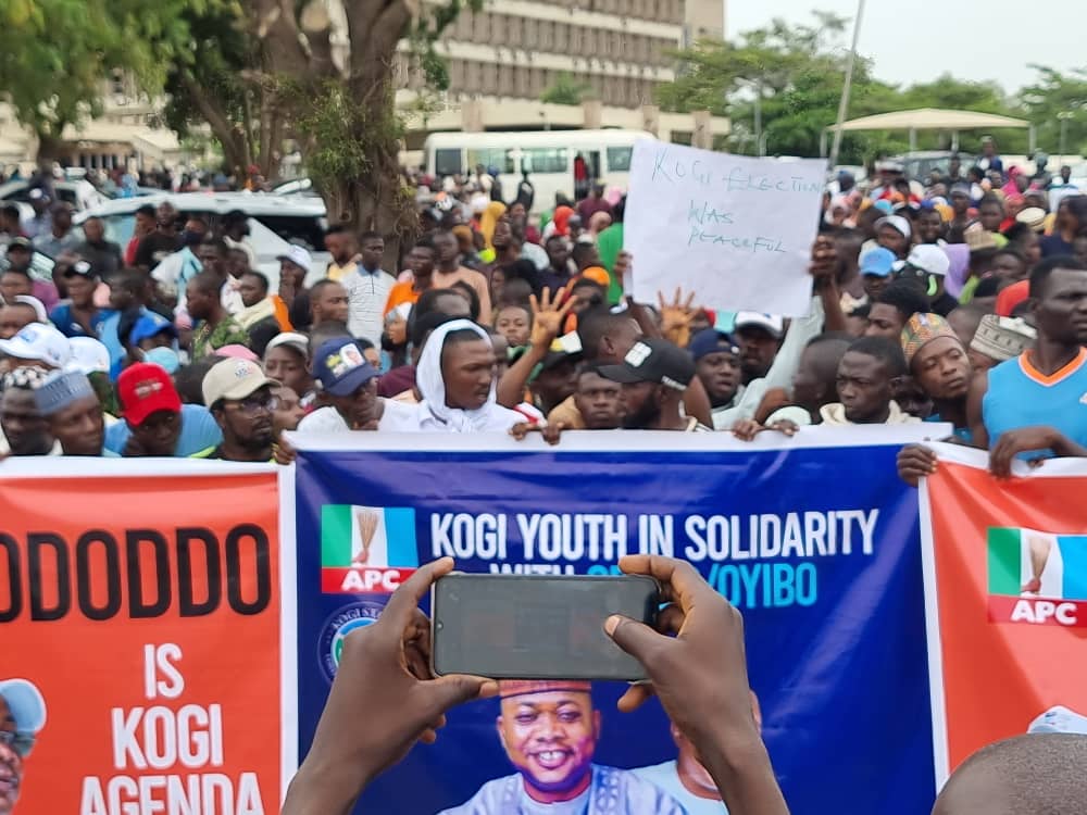 Gov poll: Kogi youths storm INEC headquarters, back election outcome . Warn 'bad losers' against blackmailing umpire . Vow to occupy INEC 'as long as necessary